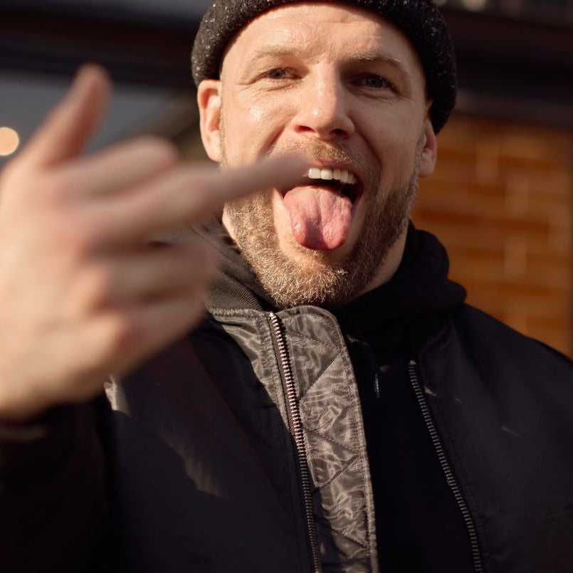 James Haskell in black jacket and black beanie. Wearing Voice_of Defiance